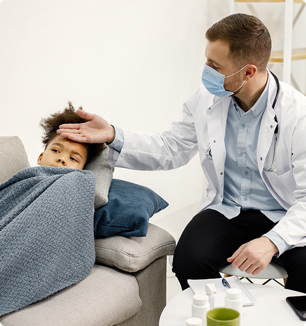 Doctor and young patient with fever